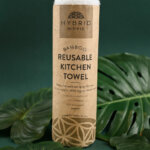 Natural Bamboo Reusable Kitchen Towel Roll in between green leaves